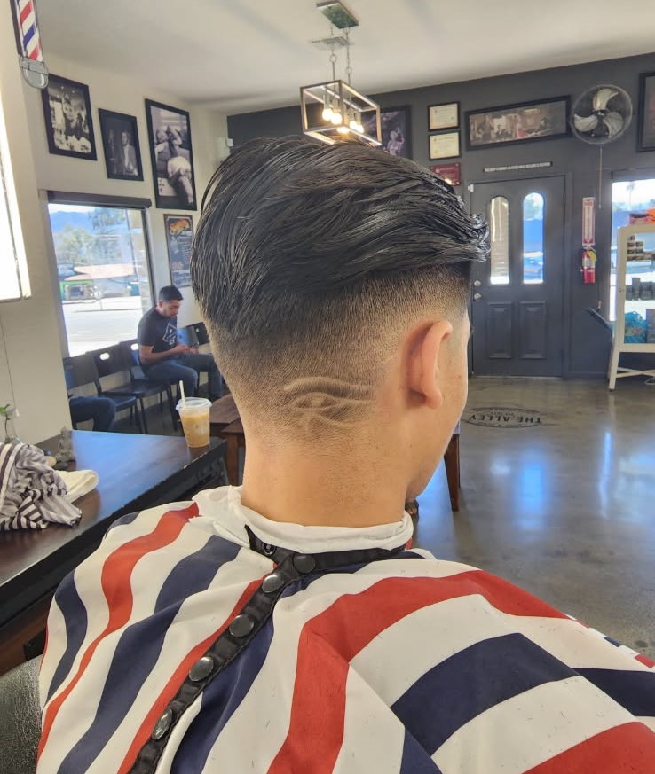 Taper haircut with a clean neckline design by Jerry