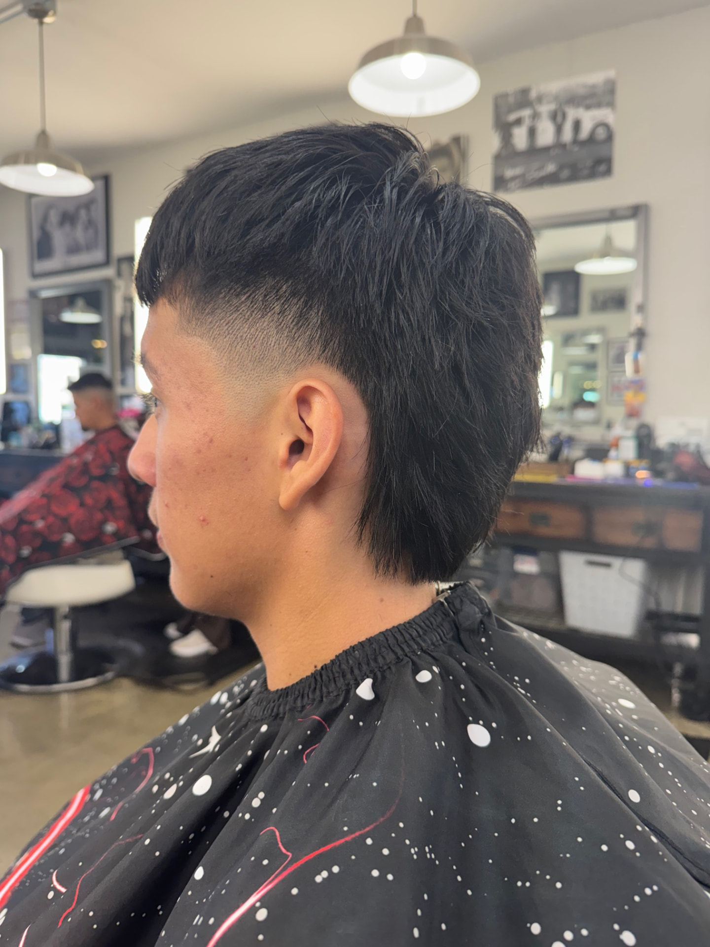 Modern mullet with a clean fade by Madeline