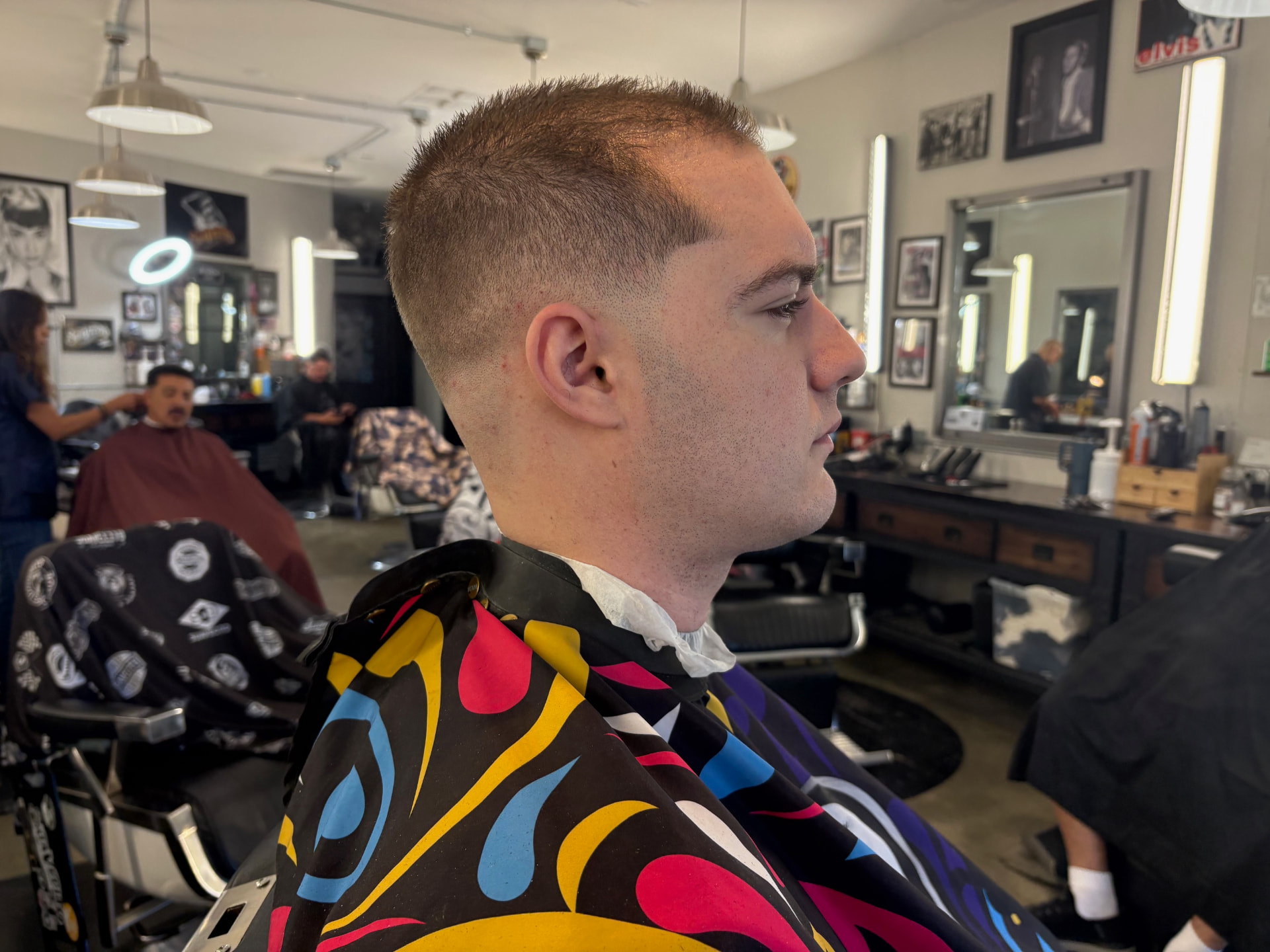 Short men's fade haircut by Kai