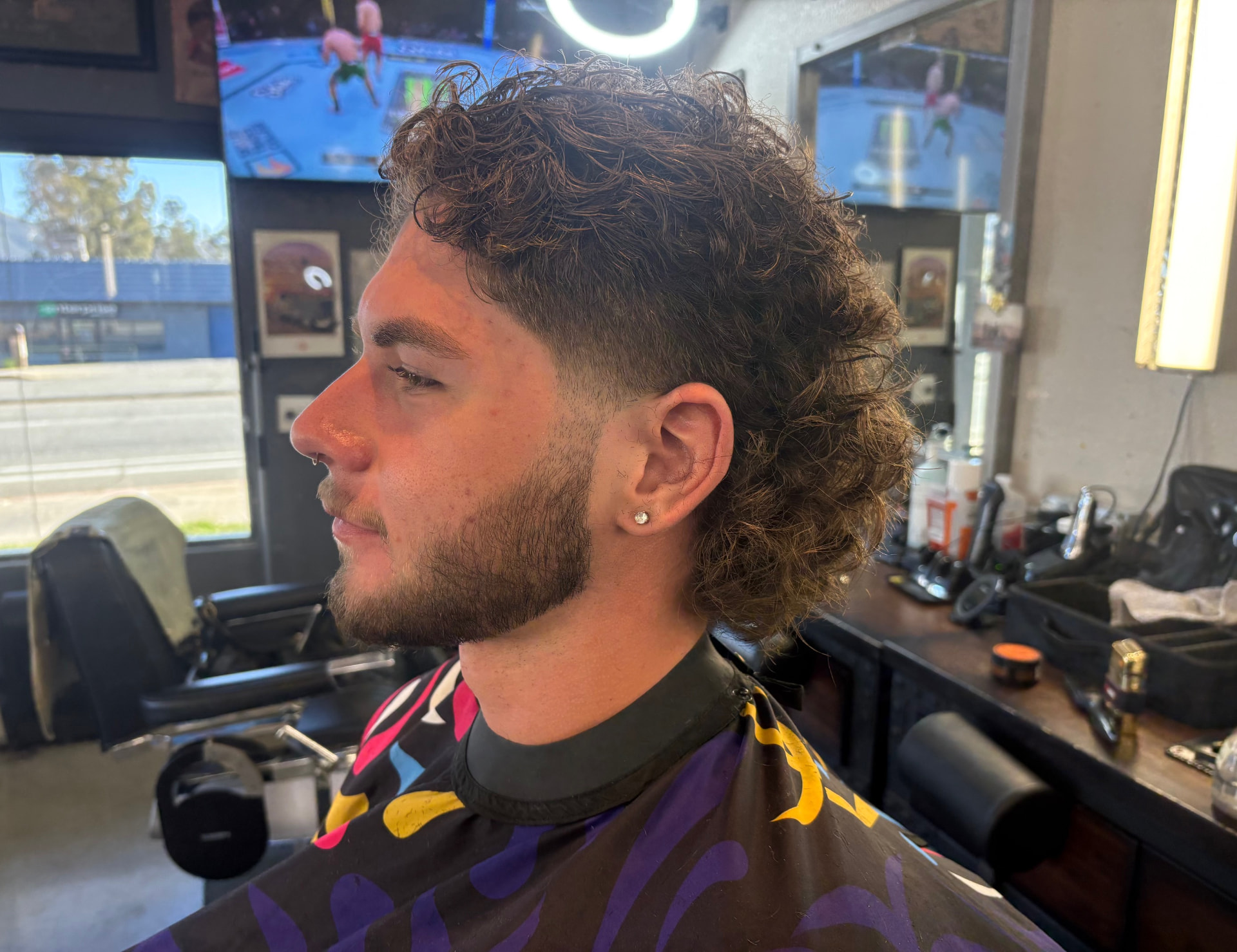 Curly mullet and beard shaping by Kai
